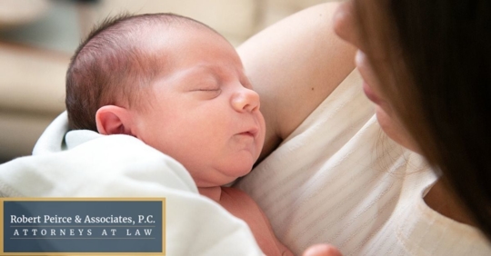 Newborn baby being held